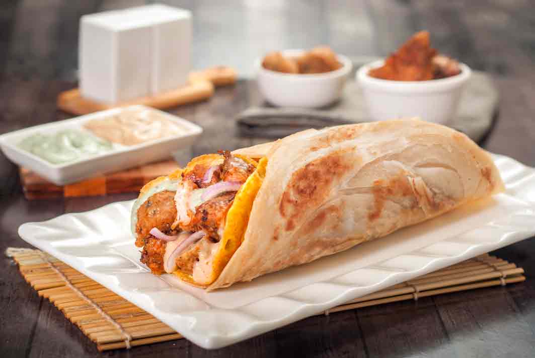 https://product-assets.faasos.io/production/product/image_1518494828409_Chicken-Overload-Jumbo-Wrap.jpg