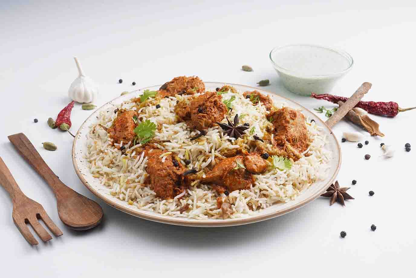 Order Lucknowi Chicken Ghee Roast Dum Biryani Serves 1 from The Biryani