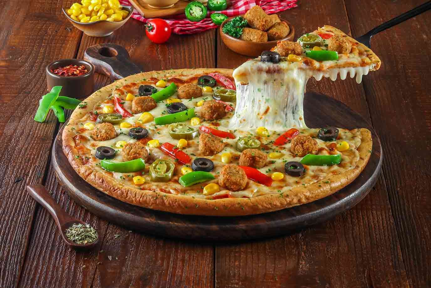 Order Veg Falafel Supreme Pizza Cheese Burst Pizza Medium online from ...