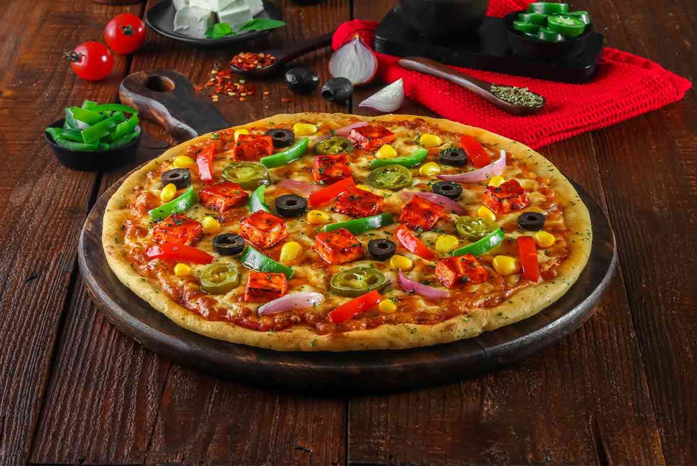 Order Maharaja Veg Tandoori Cheese Pizza from Ovenstory on EatSure