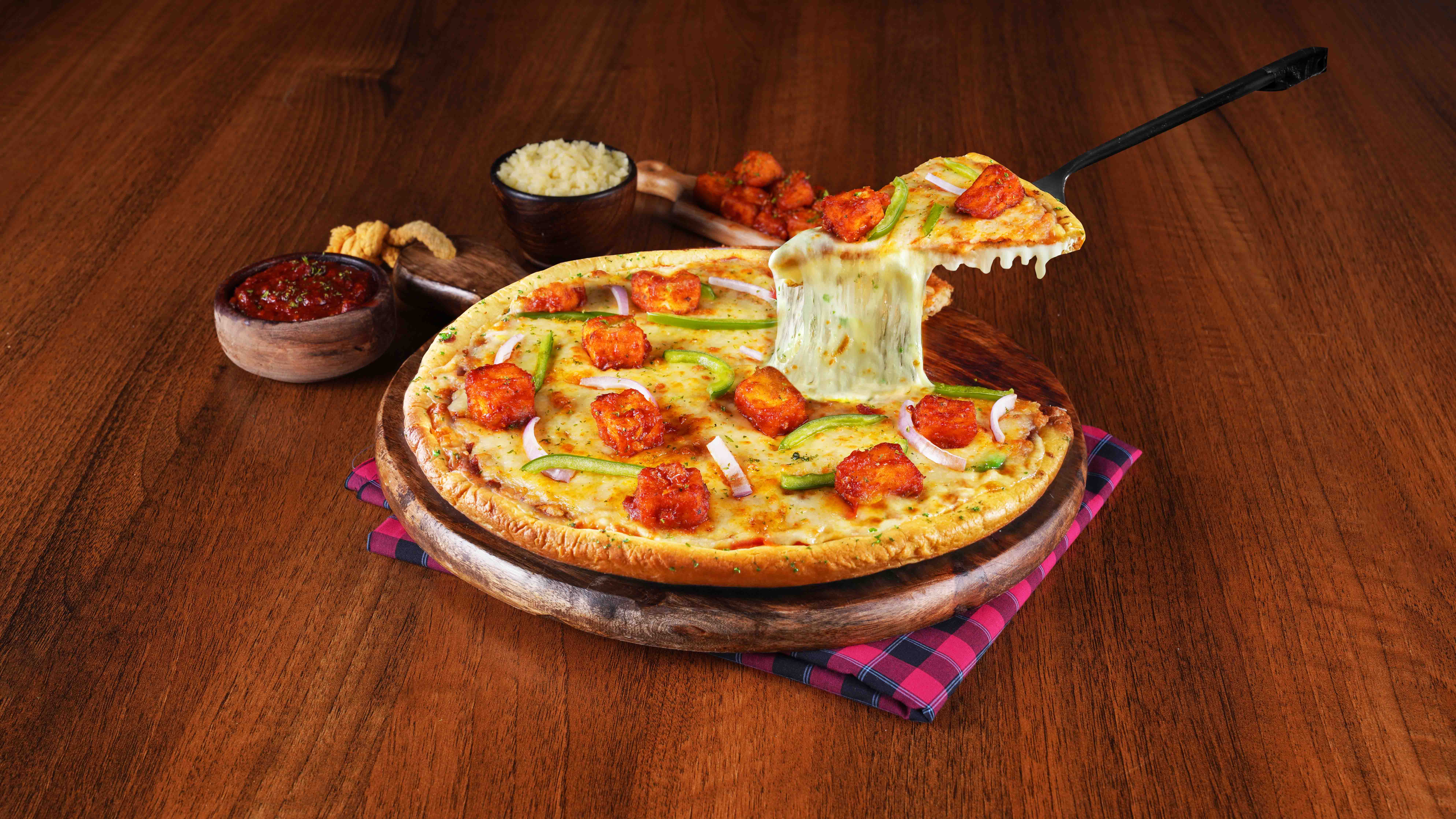 Order Schezwan Paneer Cheese Burst Pizza Medium online from Ovenstory