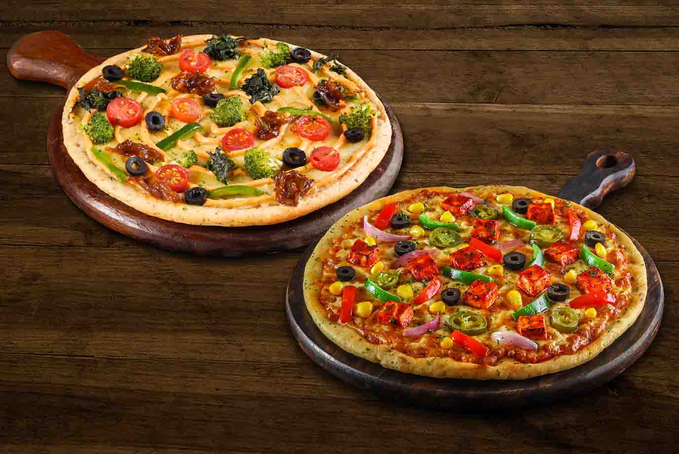 Order Two Loaded Veg Medium Pizza Combo from Ovenstory on EatSure