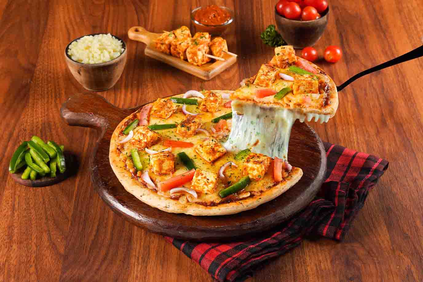Order Paneer Makhani Cheese Burst Pizza Medium from Ovenstory on EatSure